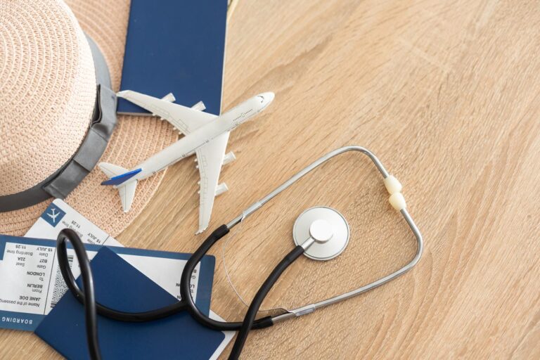 Medical tourism concept. Stethoscope with passport and tickets, toy plane